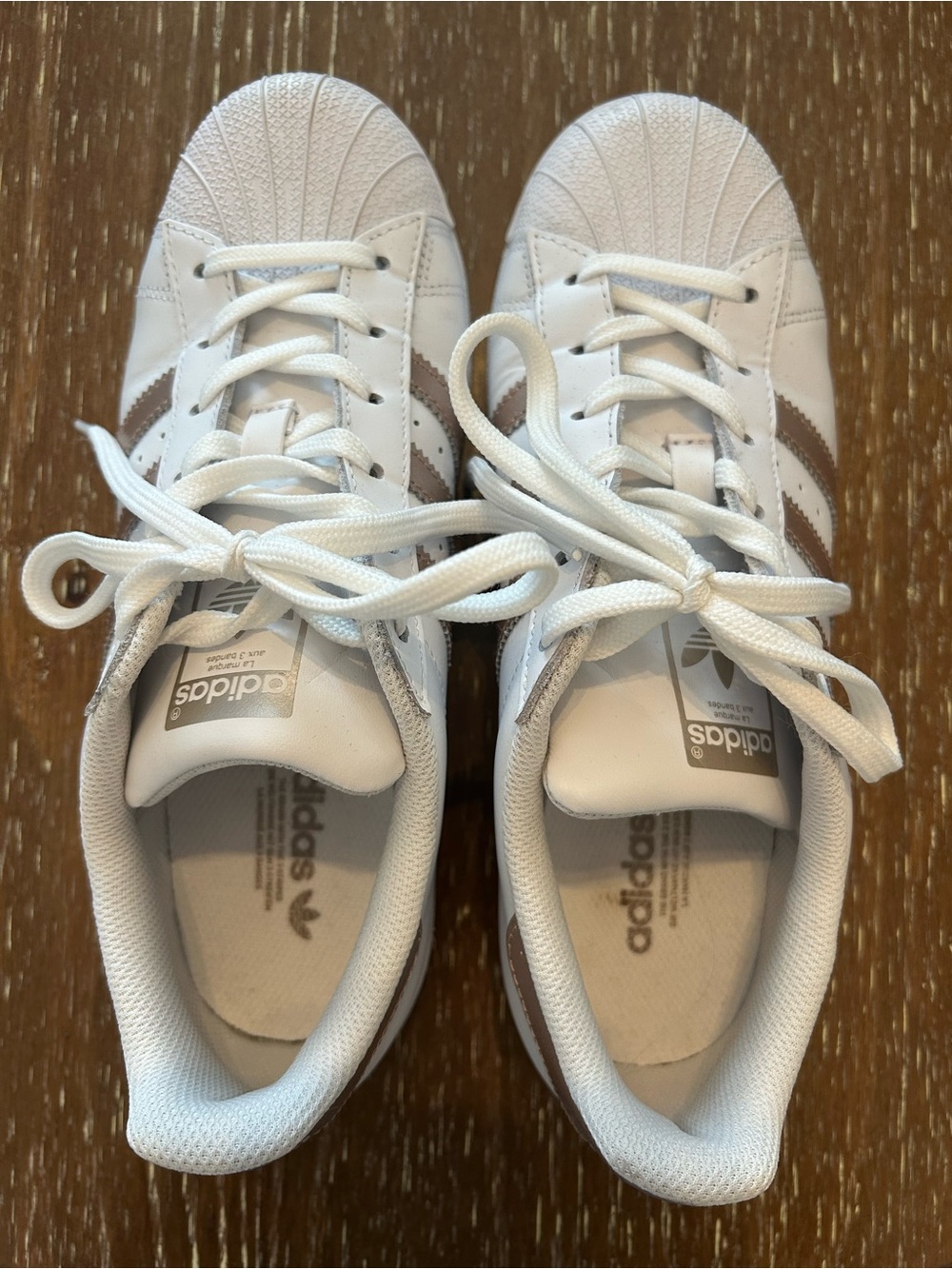 adidas White Sneakers with Gold Stripes